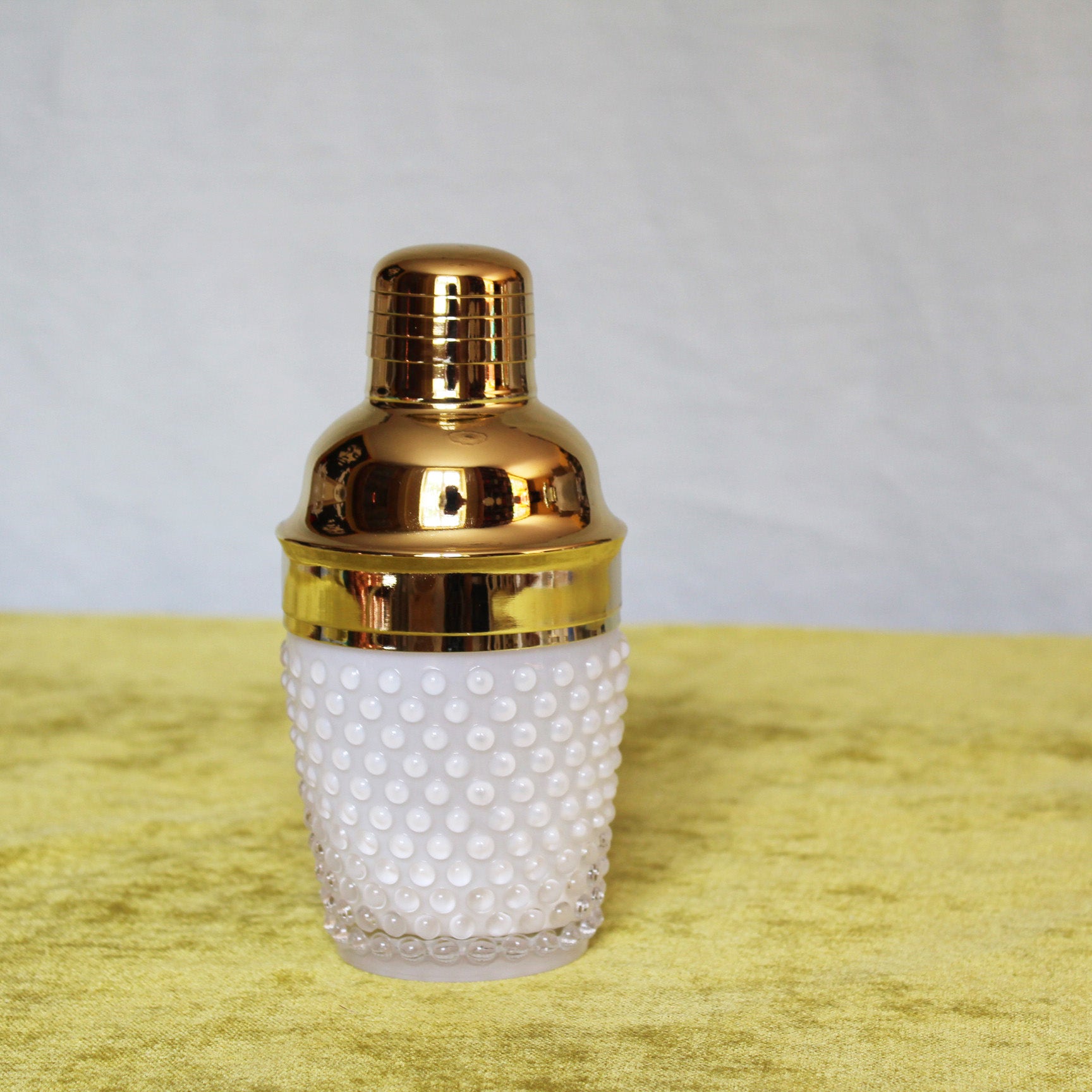white cocktail shaker gold top