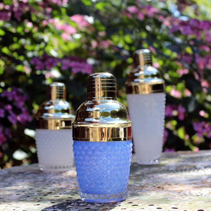 short blue glass cocktail shaker